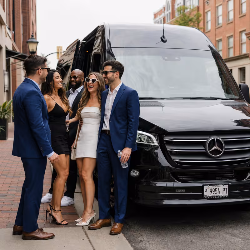 Group boarding a white charter bus for Bachelor & Bachelorette Transportation transportation in Naperville