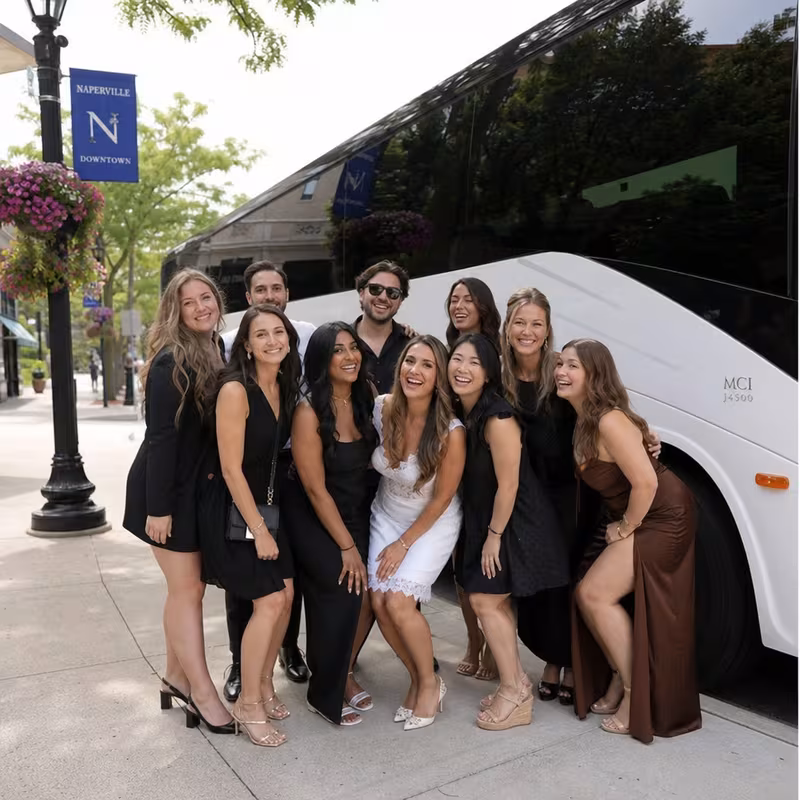 Passengers loading luggage while boarding an Naperville group shuttle