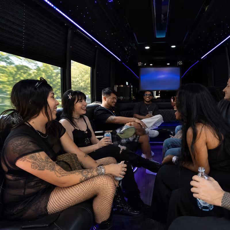 Passengers loading luggage while boarding an Naperville group shuttle