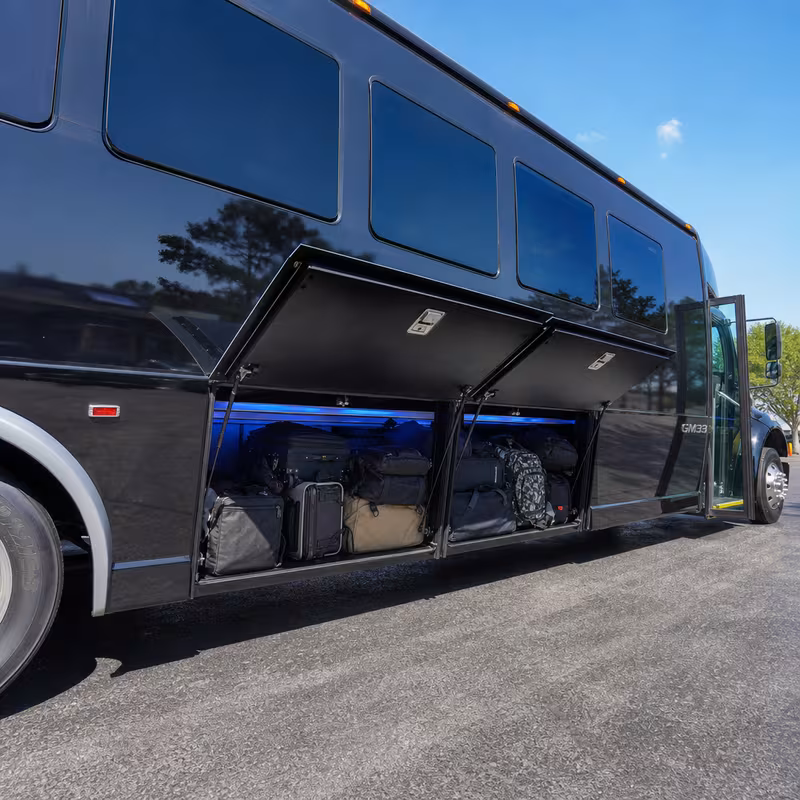 Party bus interior with wraparound leather seating and LED lighting in Naperville