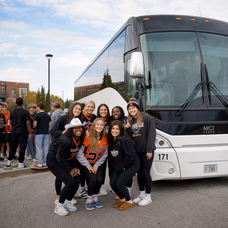 Passengers loading luggage while boarding an Naperville group shuttle