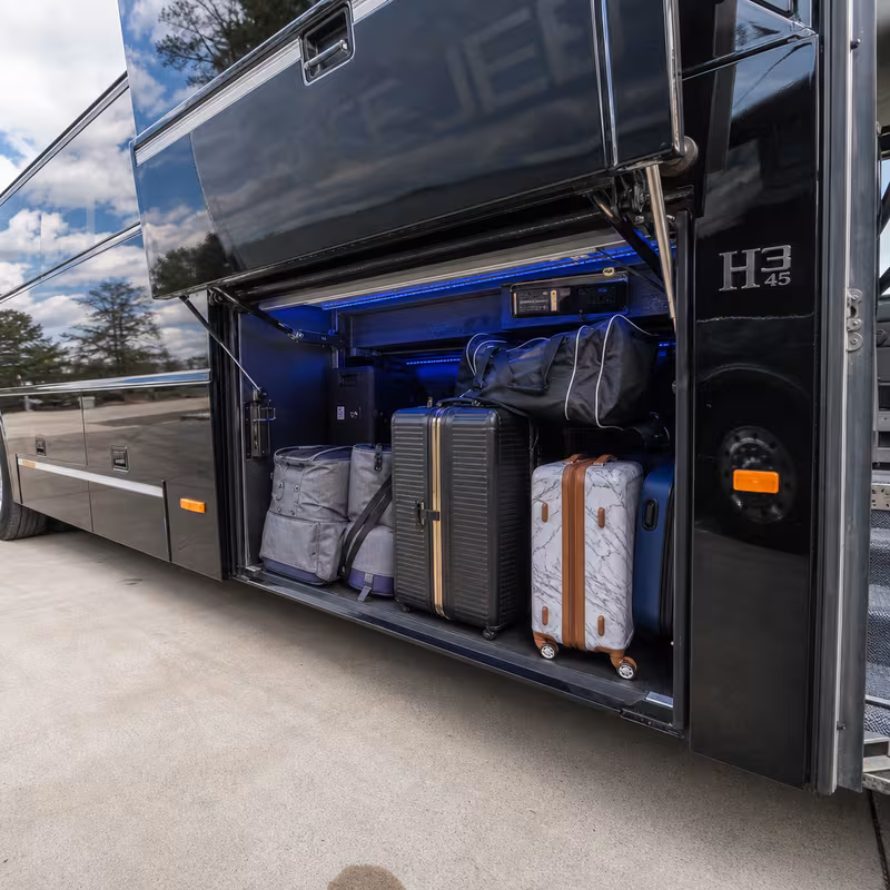 Party bus interior with wraparound leather seating and LED lighting in Naperville
