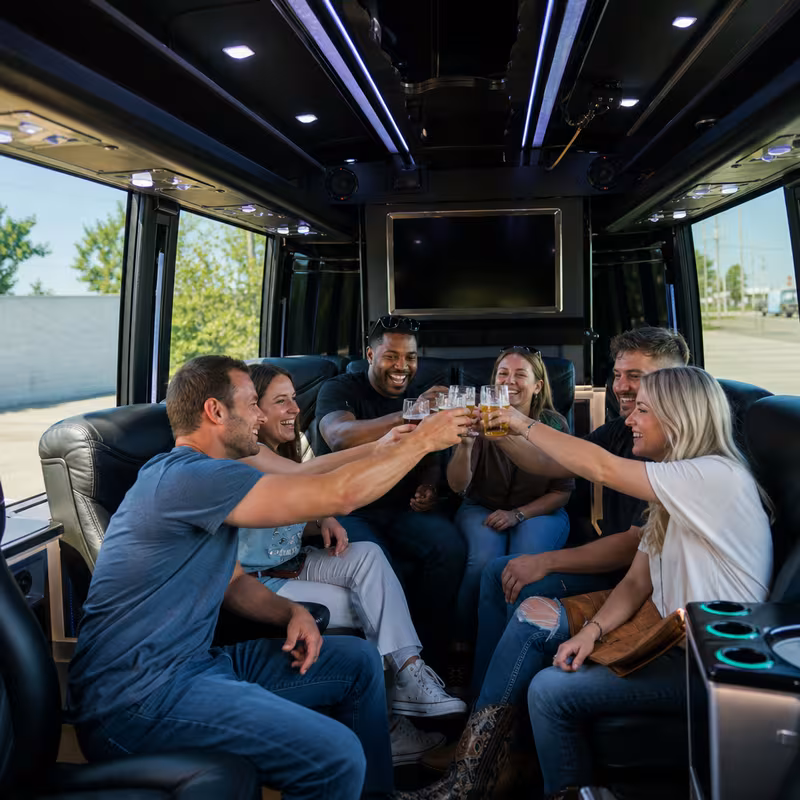 Group boarding a white charter bus for Winery & Brewery Tour Transportation transportation in Naperville